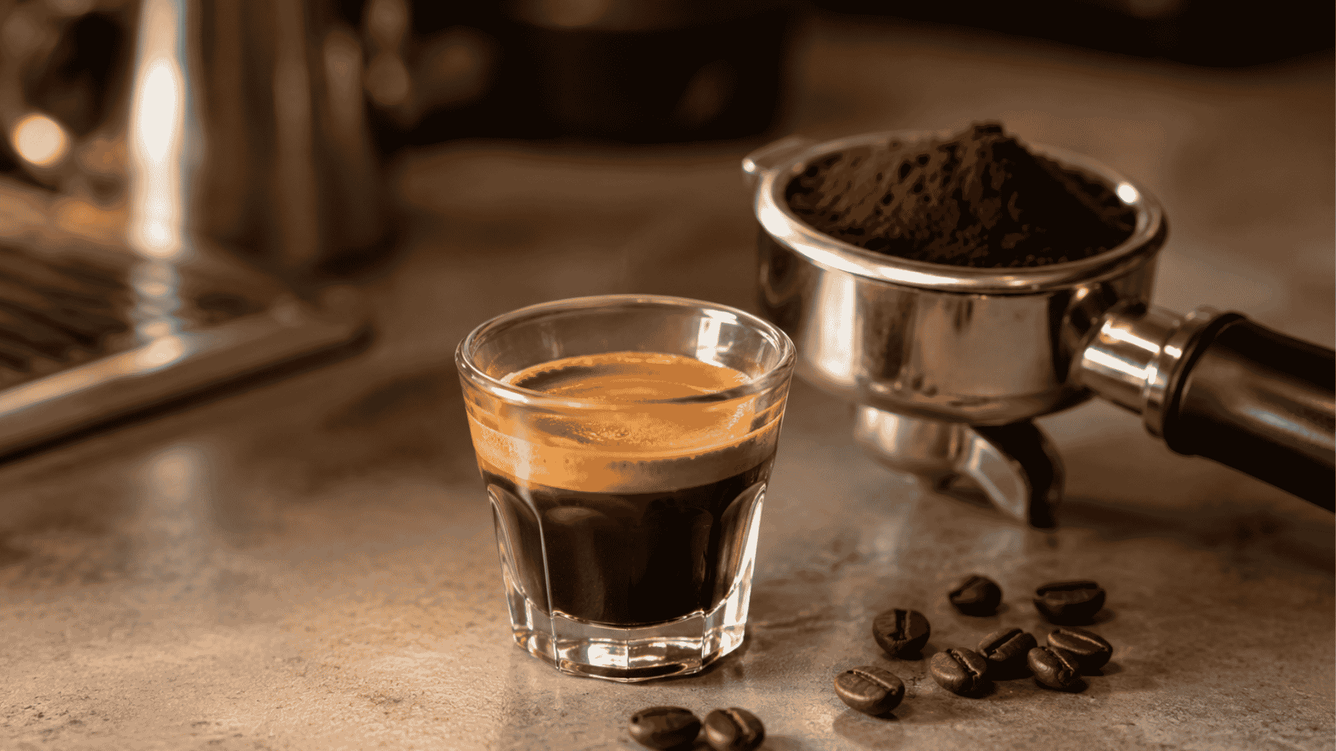 Fresh espresso with crema beside roasted coffee beans and an unbranded portafilter on a café counter