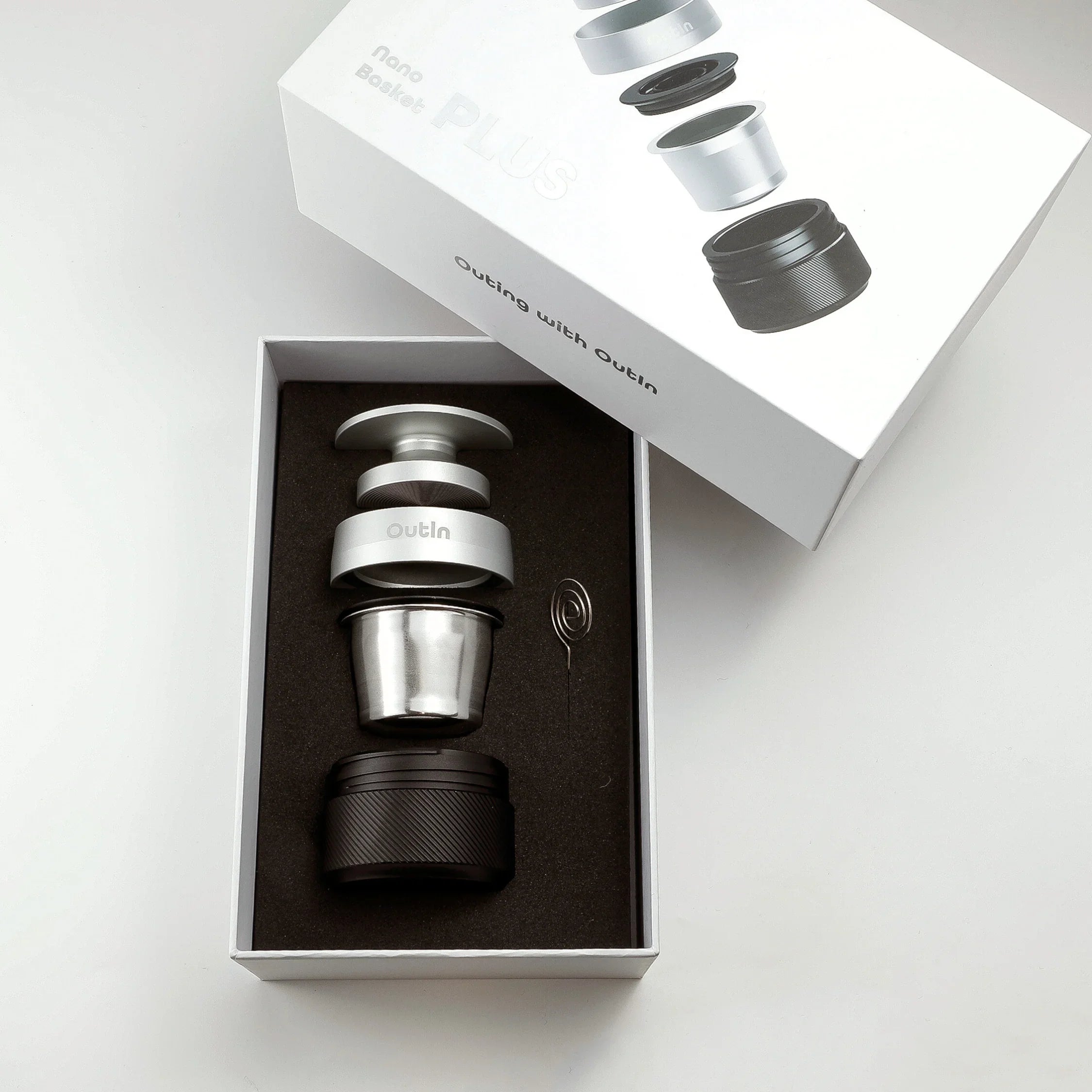 OutIn Nano portable espresso machine 16-18g basket plus set with tamper, adapter, base, wire tool in packaging.