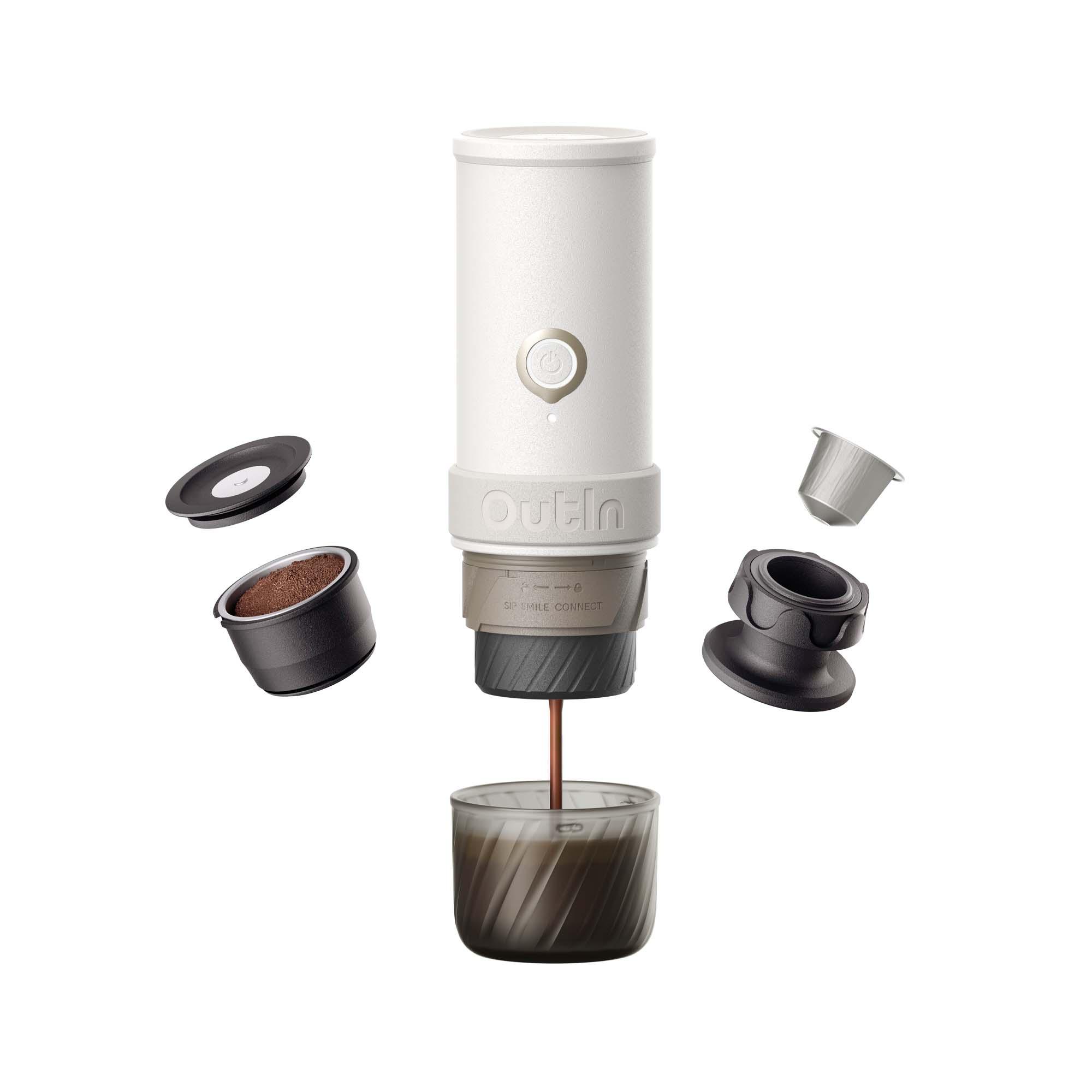 White OutIn Mino portable espresso machine brewing espresso into Tritan cup, with ground coffee basket and reusable capsule.