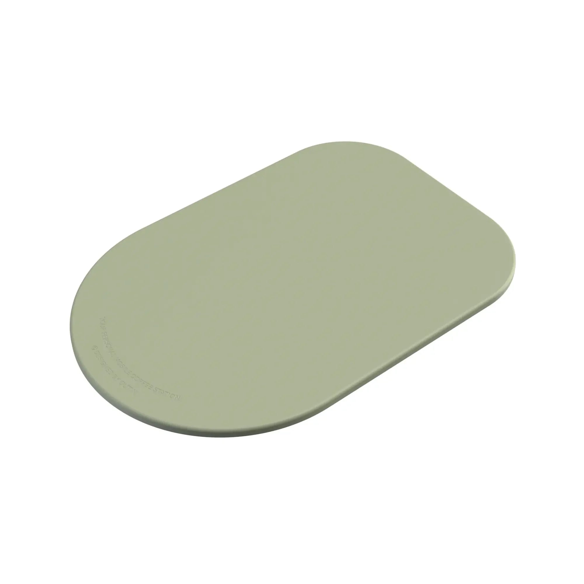 OutIn oval light sage green silicone coffee mat with embossed "YOUR PERSONAL MOBILE COFFEE STATION" text.