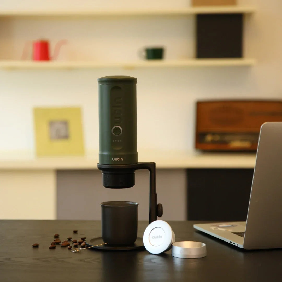 Black Universal Coffee Stand with green portable coffee maker and mug, ideal for hands-free brewing.