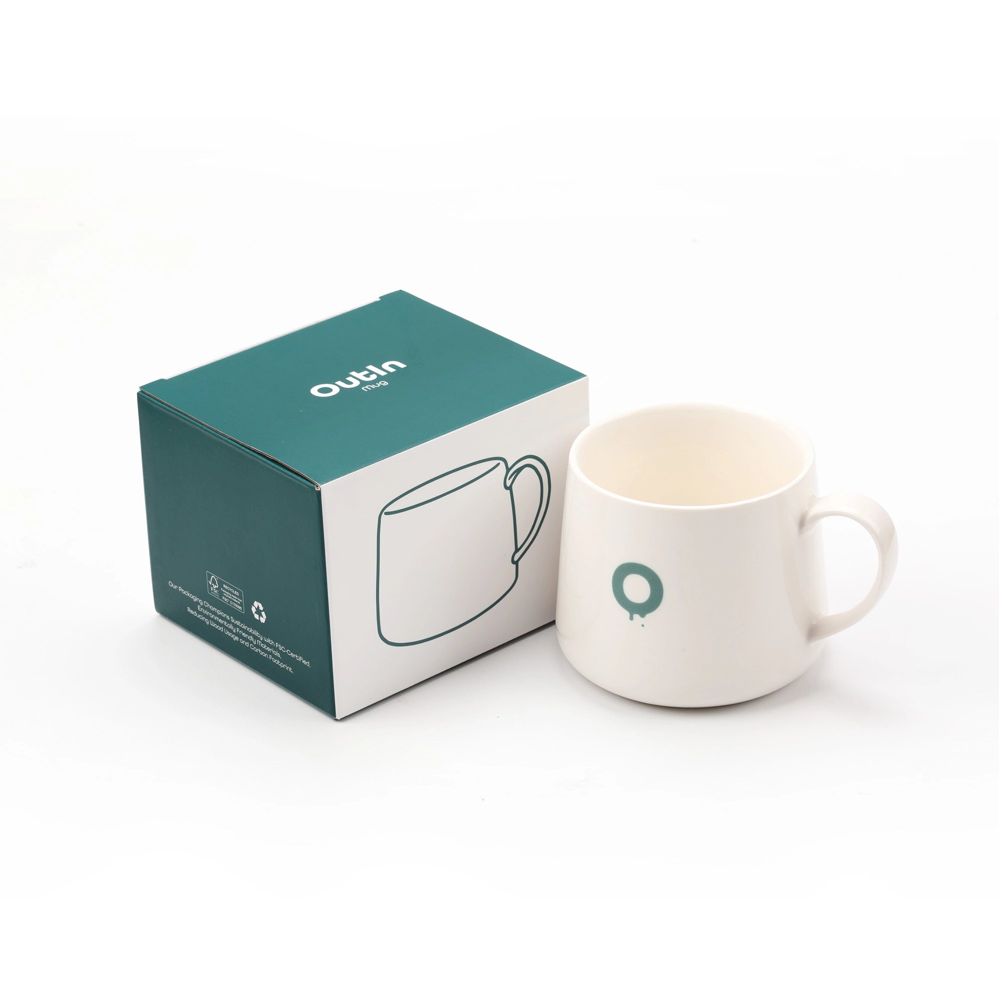 Outin Portable Espresso Machine Mug next to its teal and white packaging box