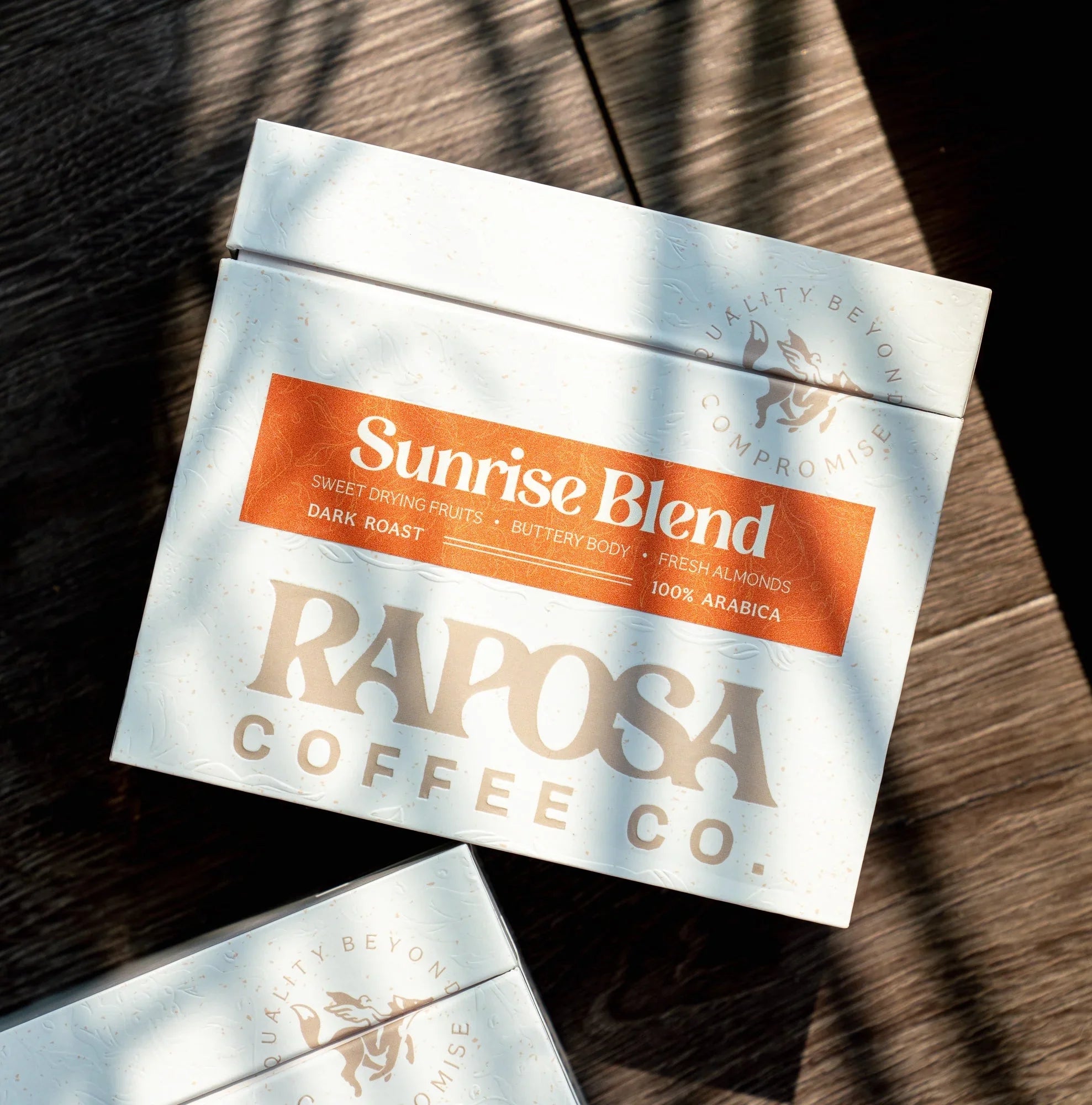 Raposa Coffee Co. Sunrise Blend dark roast box with tasting notes: sweet drying fruits, buttery body, almonds.