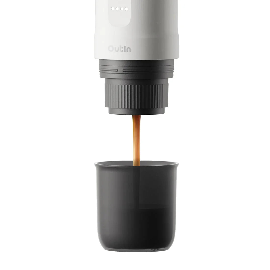 Pearl white Nano portable espresso machine brewing rich espresso with crema into a cup.