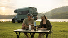 Travelers using OutIn portable coffee makers at a lakeside campsite