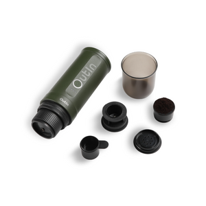 Outin Nano Portable Espresso Machine in Forest Green with accessories.