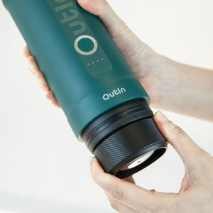 User connecting the Outin Nano Basket Plus to the Outin Nano Portable Espresso Machine.