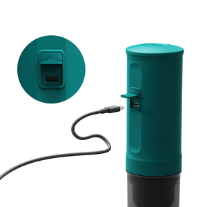 Teal Nano Portable Espresso Machine with USB charging connected for portability.